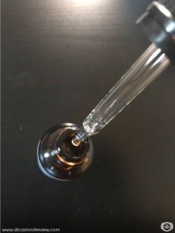 Taking oil using a glass dropper