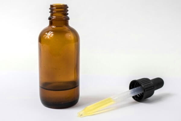 Castor oil in amber glass bottle 