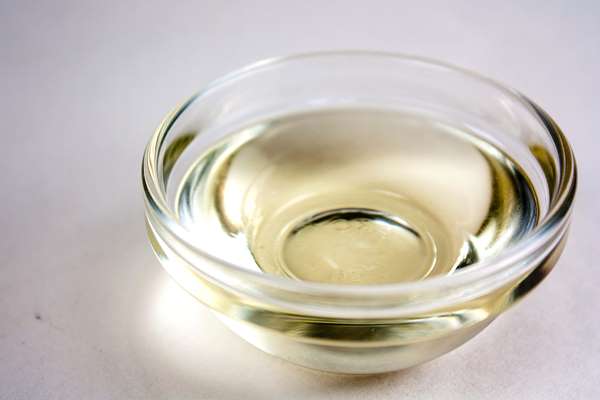 Clear castor oil with pale yellow color