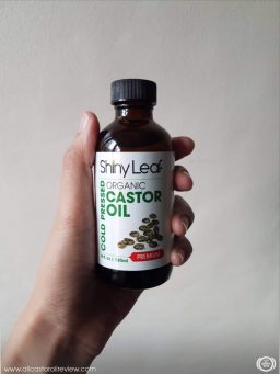Showing the label of Shiny Leaf Castor Oil 