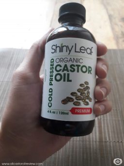 closeup of the Shiny Leaf Castor Oil bottle